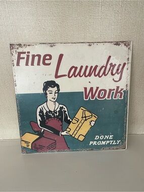 “Fine Laundry Work, done promptly” metal wall sign. Meant to look vintage.